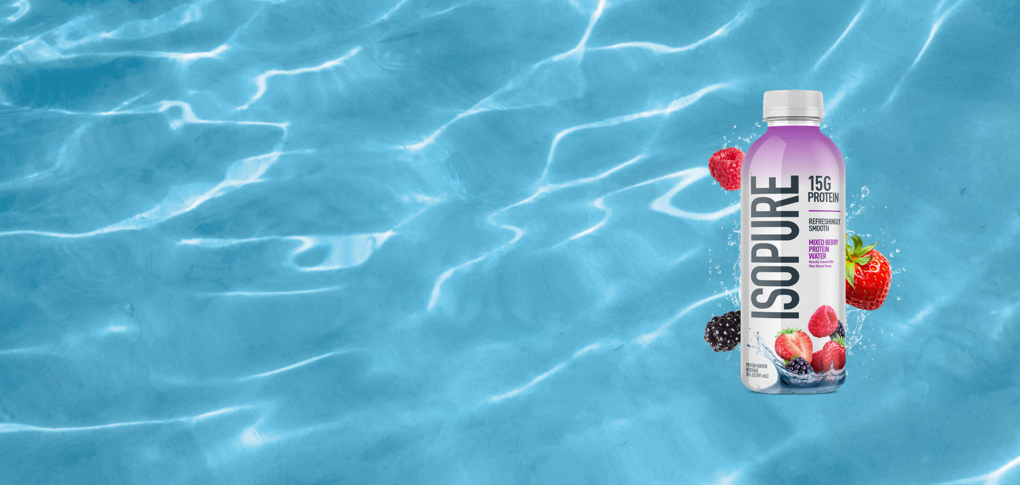 Isopure protein bottle with berries against a blue water background