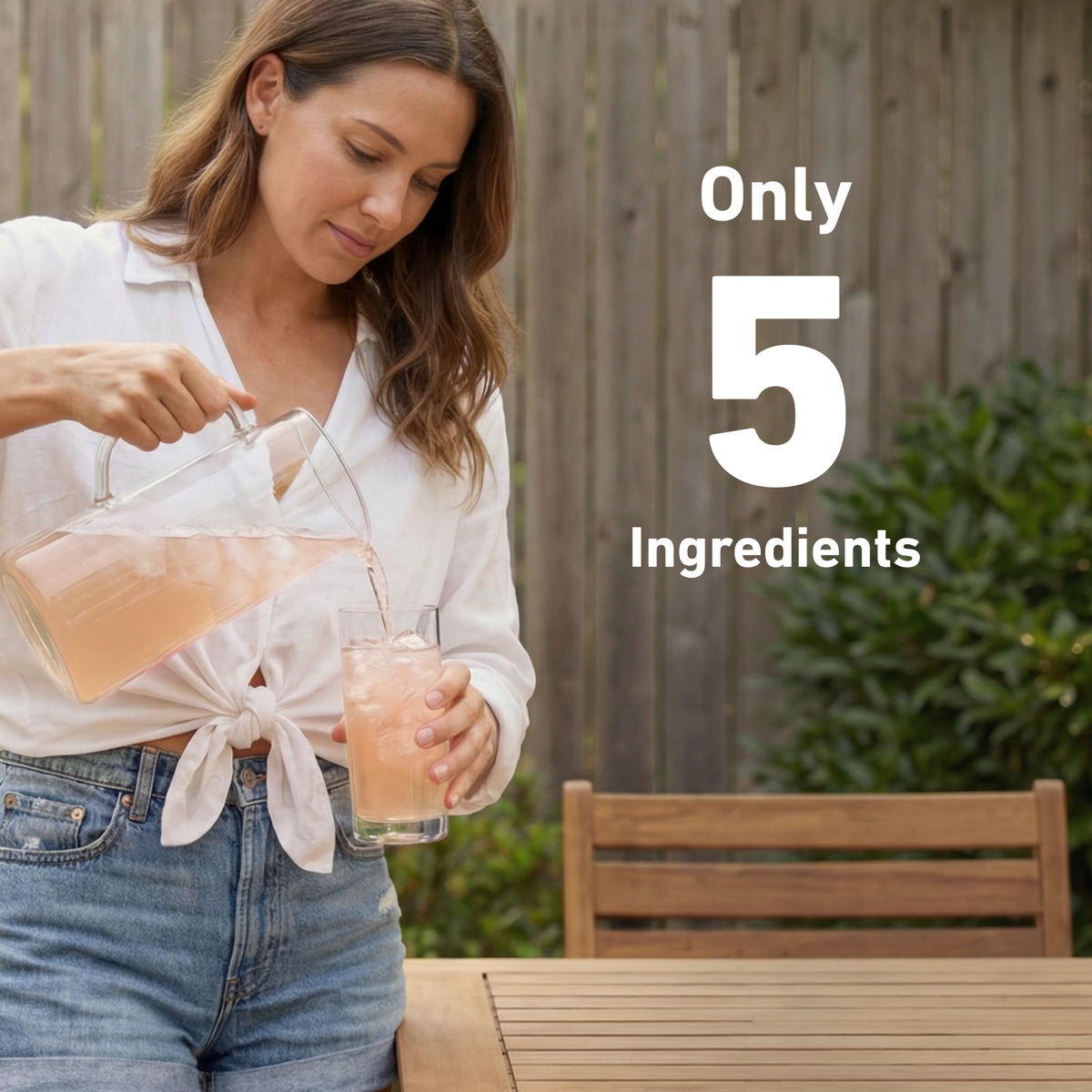 A woman in a white shirt and blue jeans pours a pink drink from a clear glass pitcher into a glass tumbler outdoors. A wooden fence, bench, and greenery are in the background, with large white text reading 'Only 5 Ingredients'.
